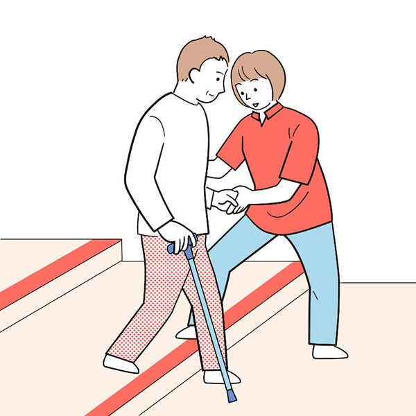 要介護者が階段・段差を下るところを介助者が介助しているイラスト
